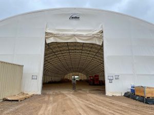 entrance to fabric structure with worker inside