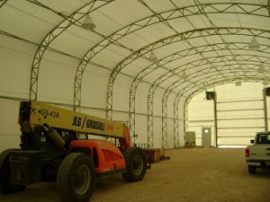 construction equipment housed within a fabric structure